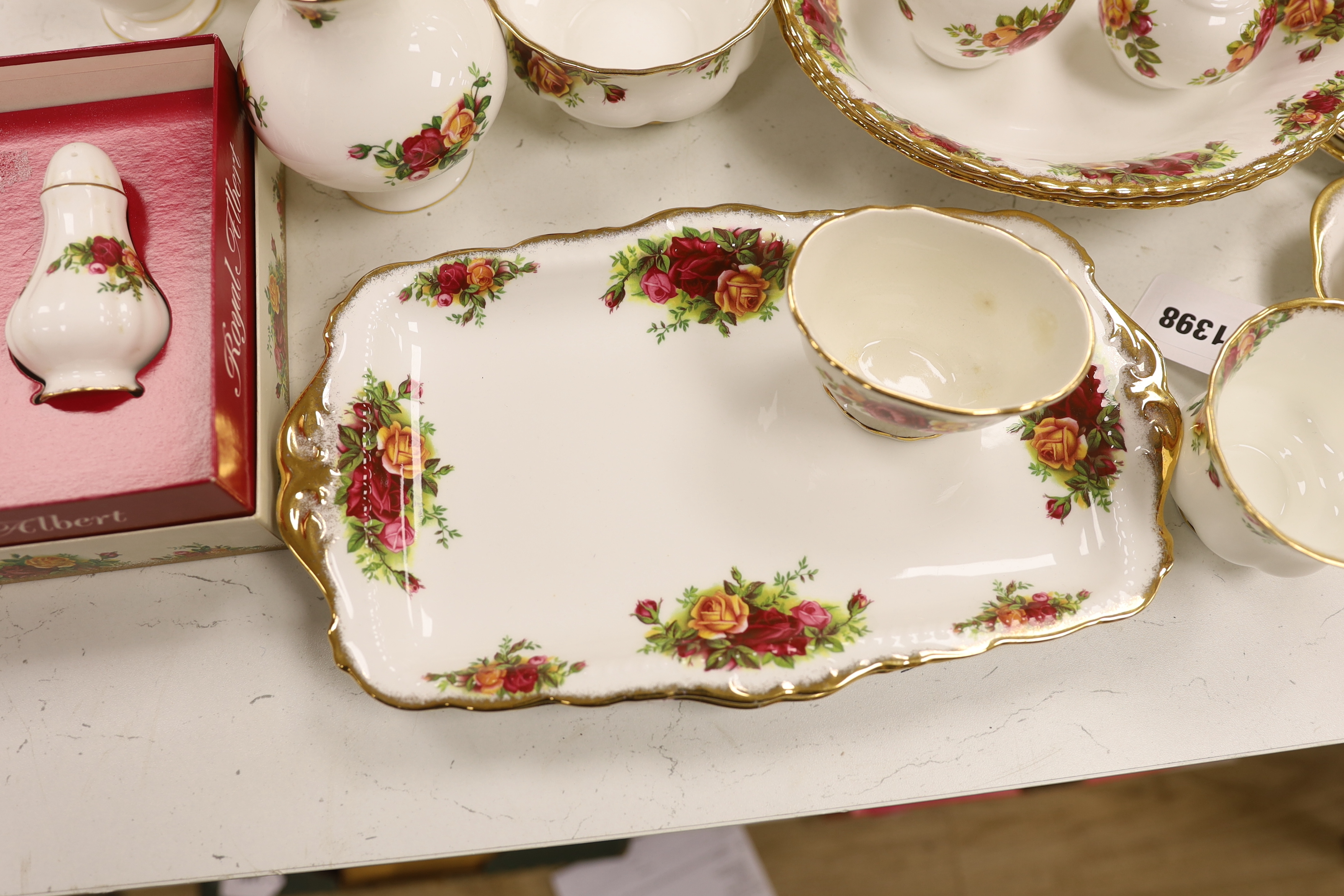 A Royal Albert Old Crown Roses dinner and tea service and a Doulton Lambeth vase